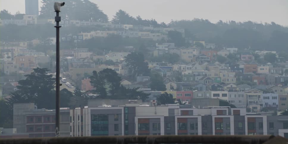 Colorful houses on the hills of san francisco under light fog at morning