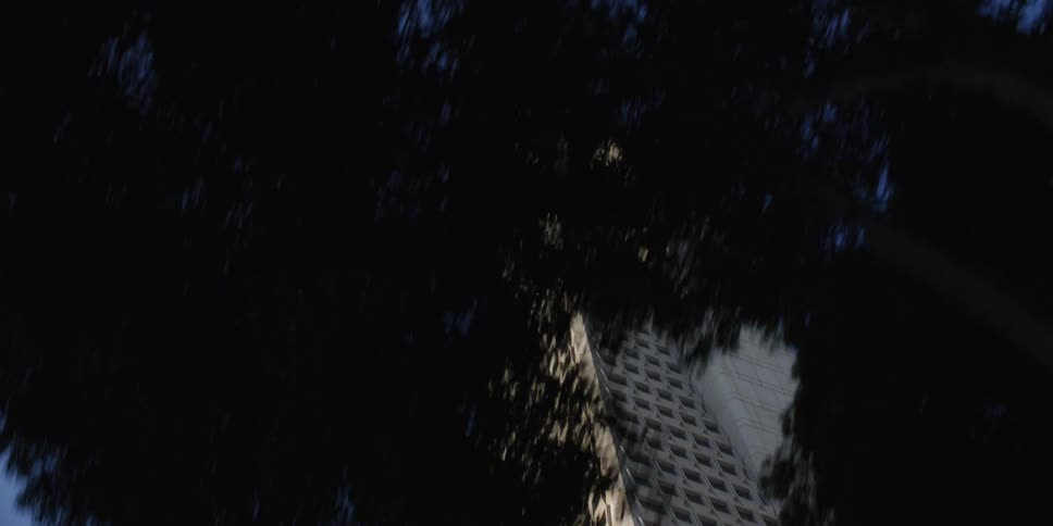 A triangle shaped skyscraper sits downtown