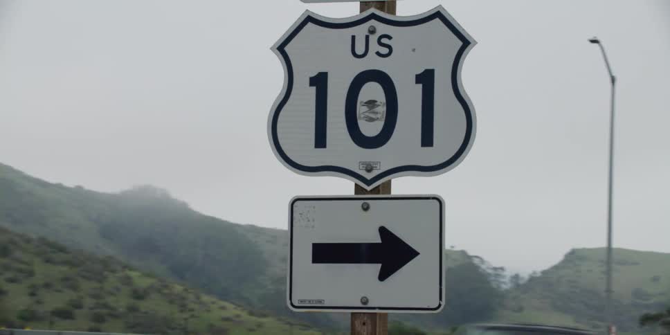 A sign is posted on the highway