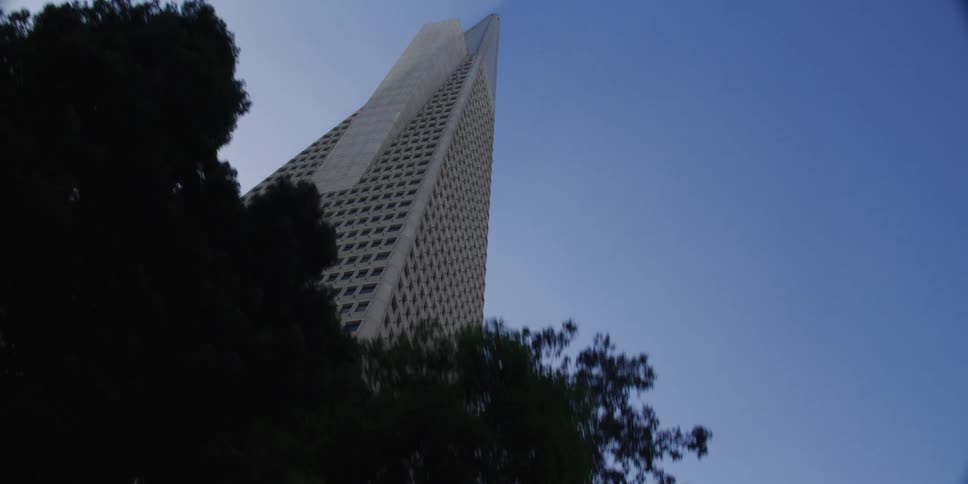 Tall triangular building with multiple windows