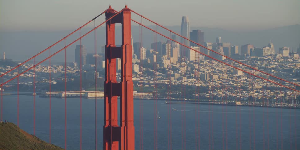 View of skyline while driving by golden gate bridge on a hazy day