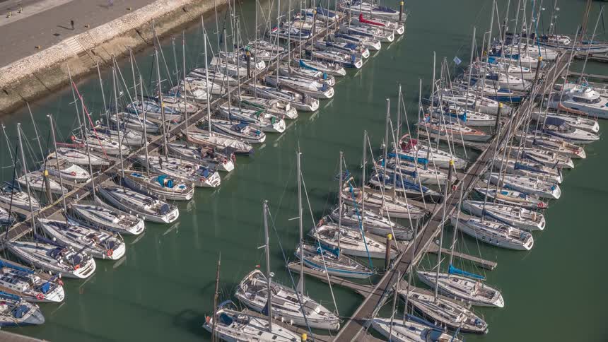 Time lapse of sailboats docked on a marina at daytime