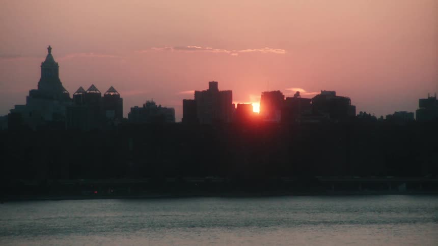 Sunrise with a city skyline