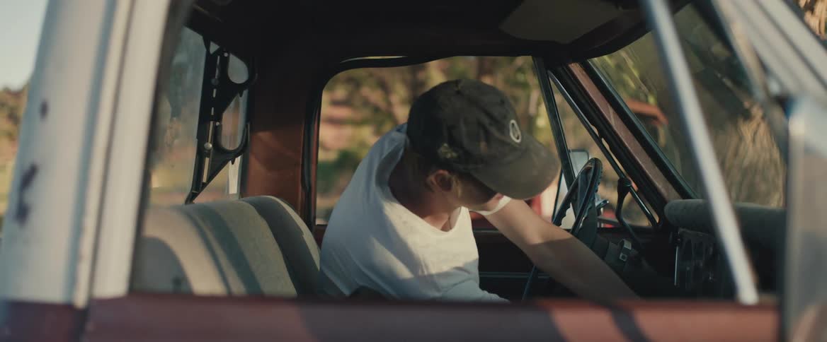 A man gets into his truck and drives off