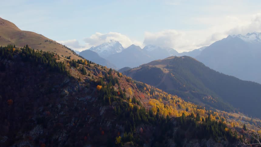 Trees line the side of a steep mountain