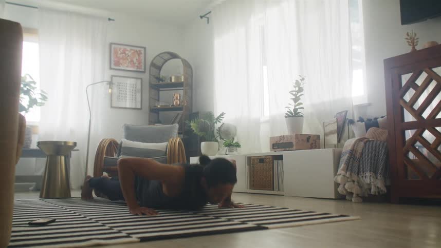 Man sets mobile phone then does push ups