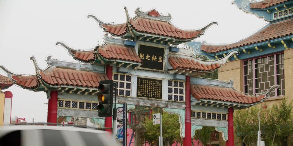Cars are driving through a city in asia