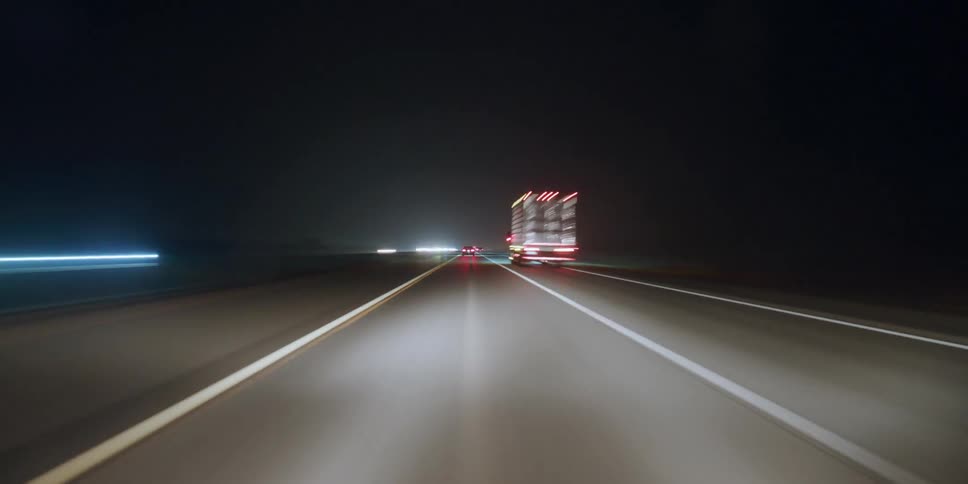 Time lapse of cars driving down a freeway at night