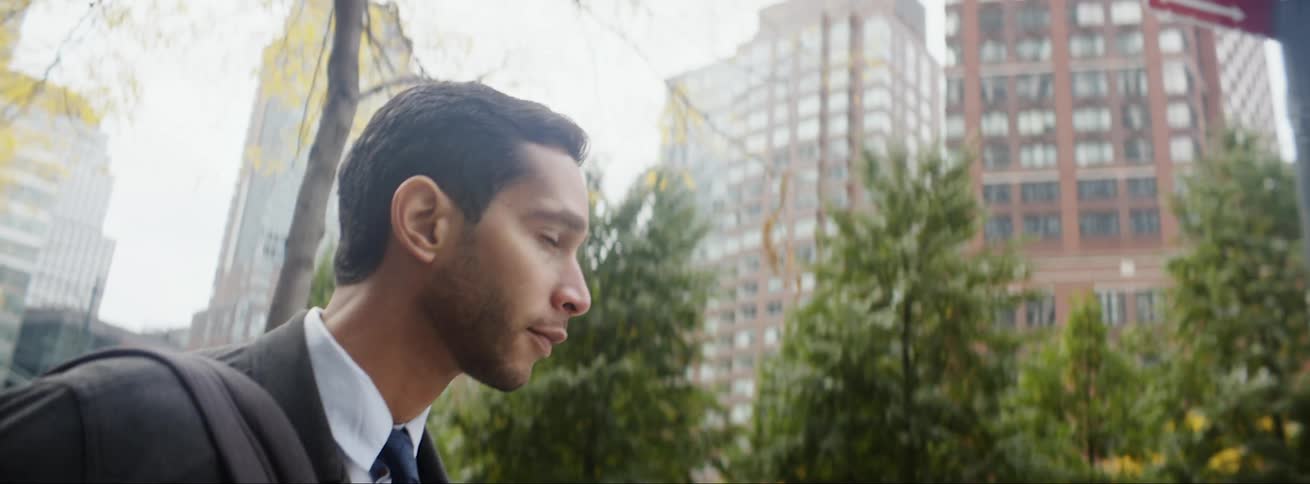 A man is walking through the city