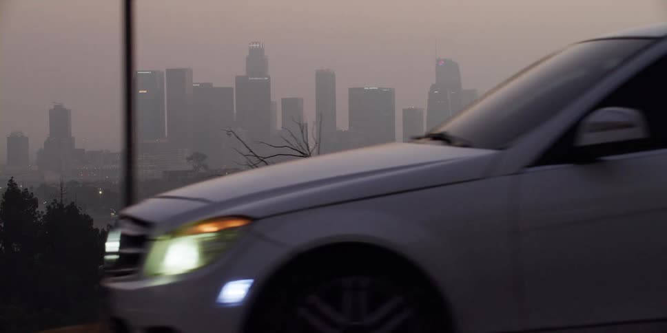 City skyline with high rise building in fog at dawn