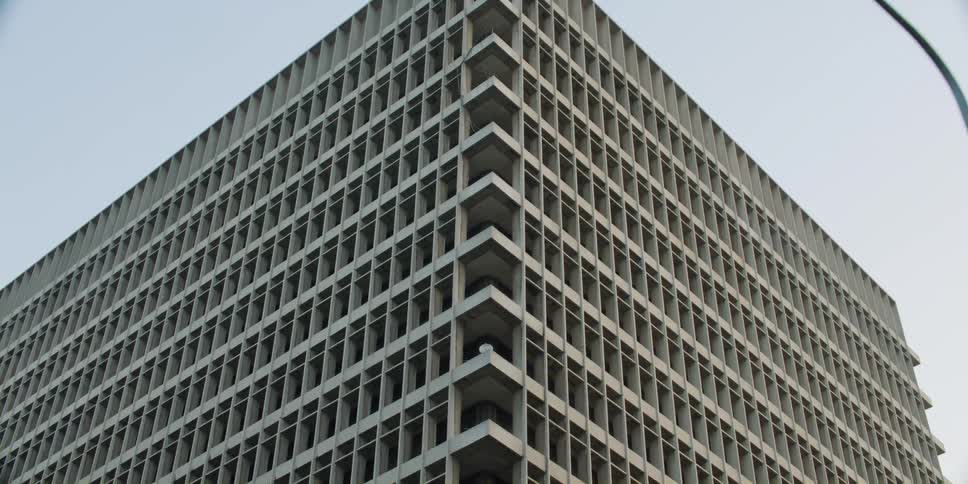 Aerial view of a building in a city is displayed during the day