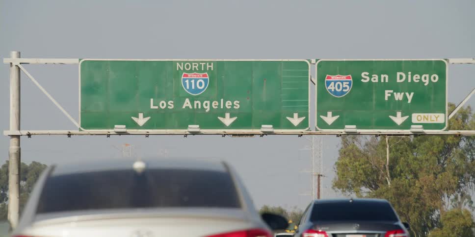 Traffic moves on a highway into the lane going to los angeles