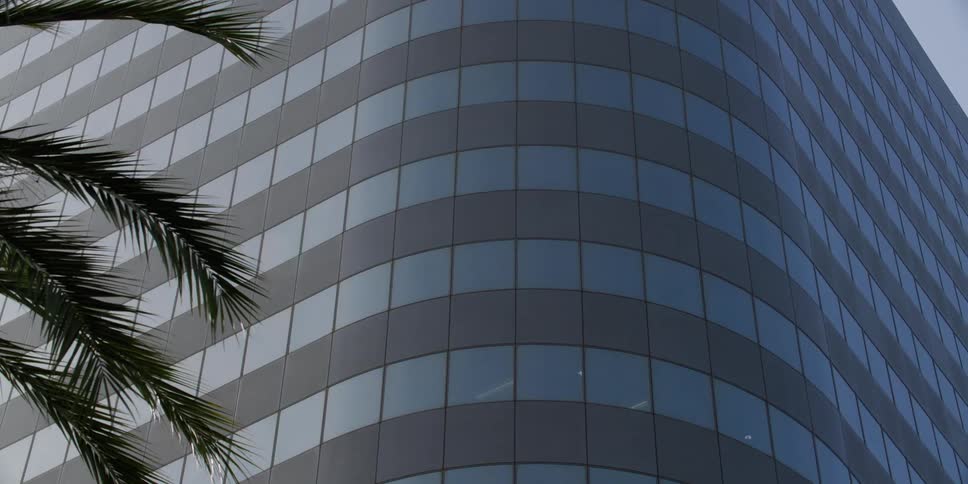 The exterior of an office building in a city
