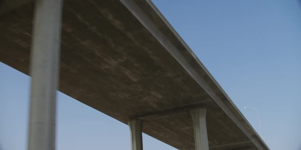 View of a highway bridge from underneath on a clear day
