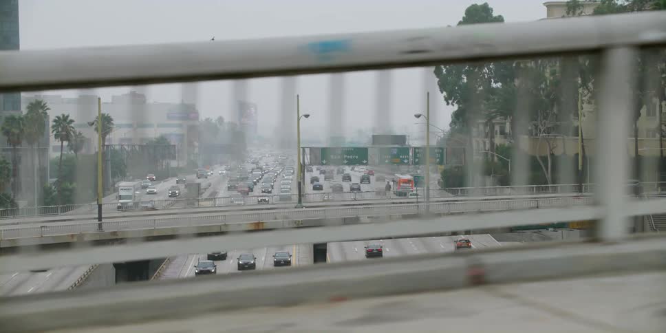 Vehicles travel along the busy highway
