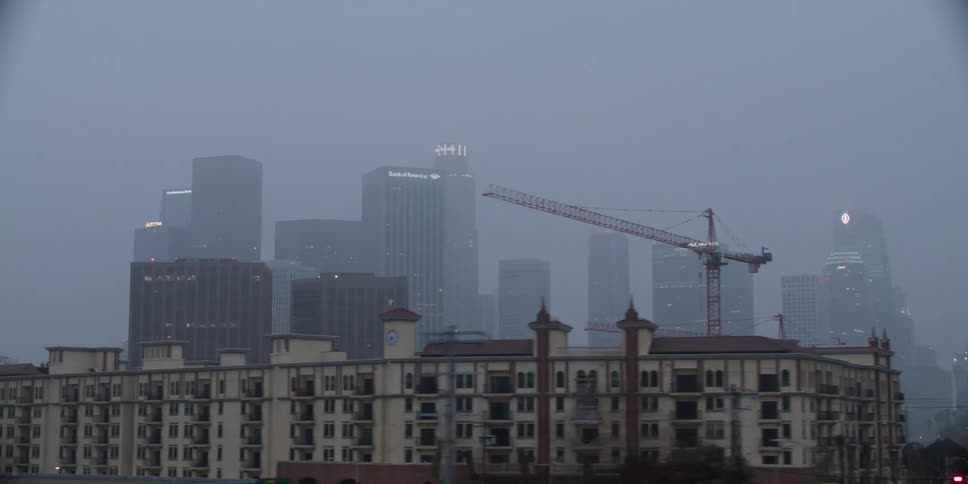 City skyline with high rise buildings in foggy at dusk