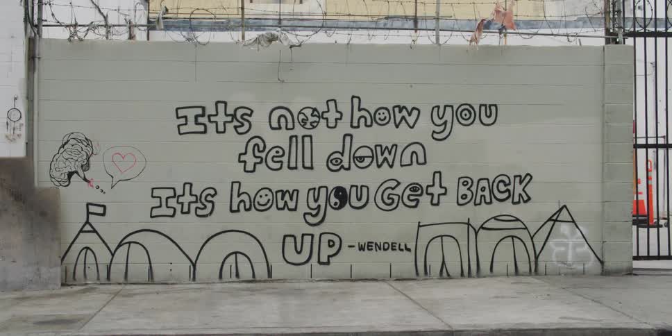 A message in graffiti is on the wall