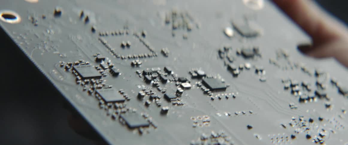 A person is holding a computer chip
