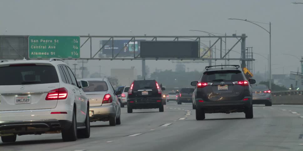 Traffic is moving steady in the fog