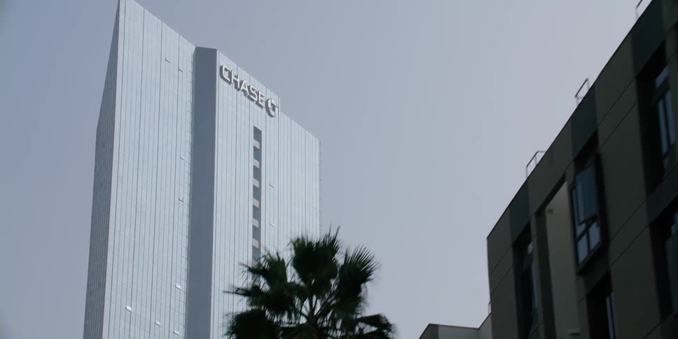 Sunlight shines on the chase building tower downtown