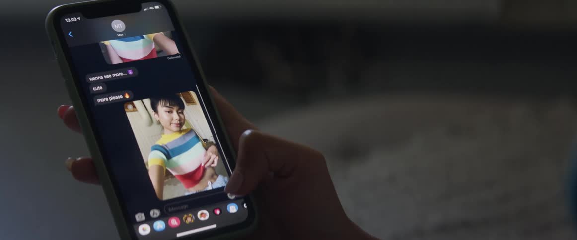 Young asian female taking a selfie with cell phone