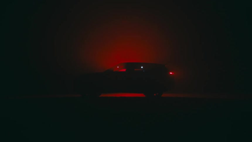 A person entering a suv car and turning it on at a dark place with a red light behind it