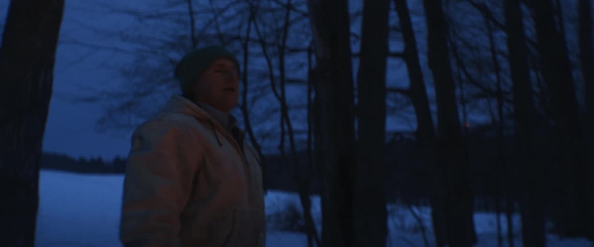 A man throws a large branch