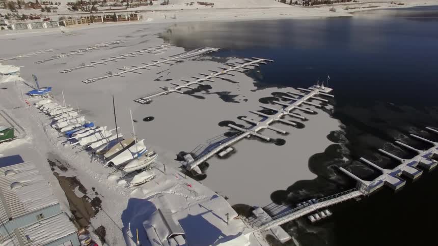 A dock surrounded by ice during the day