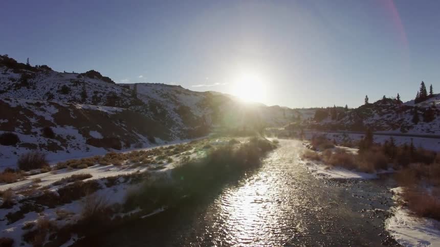 A river flowing through a wintry landscape