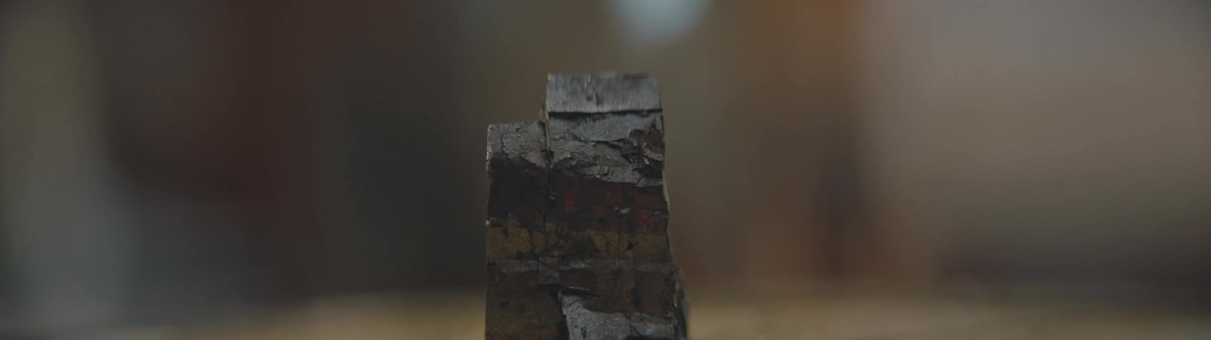 Someone sets down a piece of iron pyrite