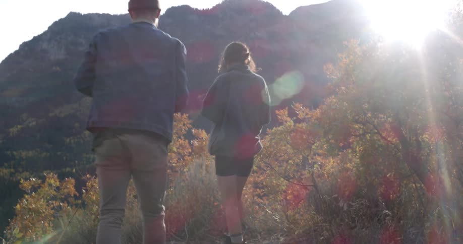 Two people waking up after camping