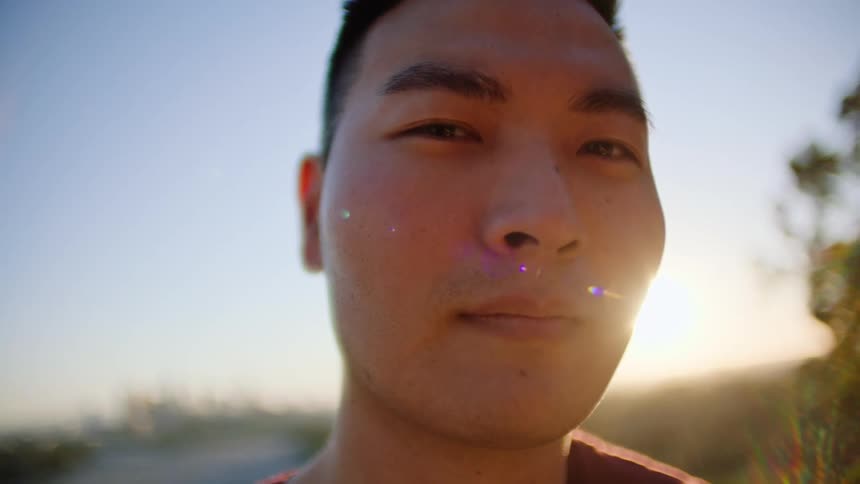 A view of a mans face outdoors