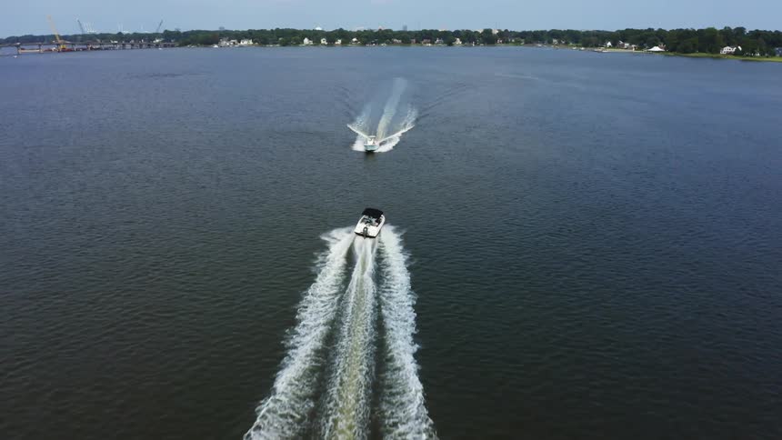 Two boats turn to avoid each other
