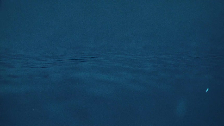 Close up view of water reflecting light as it waves and moves