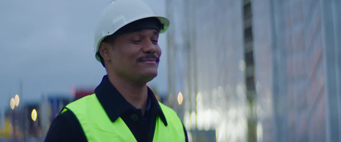 A project manager greeting someone on the construction site
