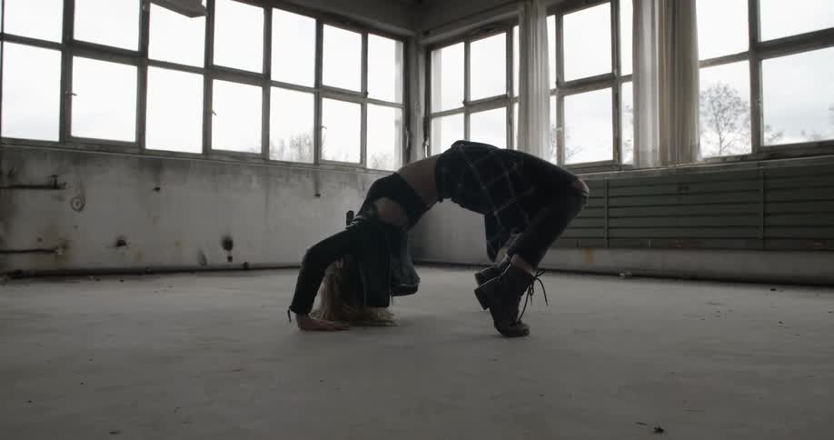 A woman performing a backbend