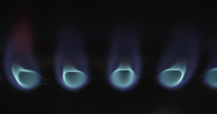 The fire on the stove is burning