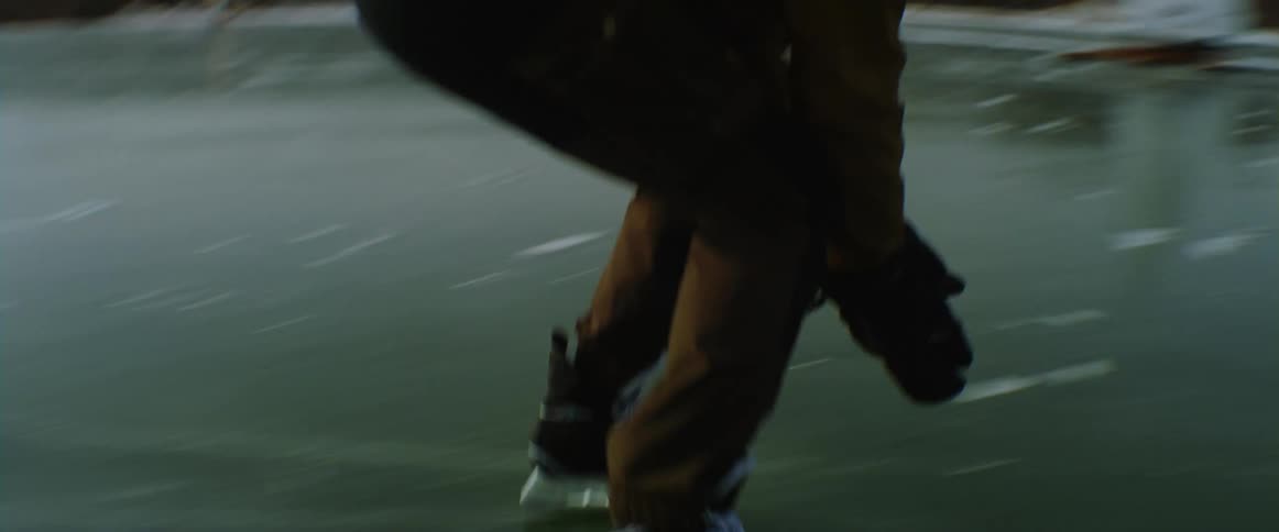 A man skates fast over the frozen lake