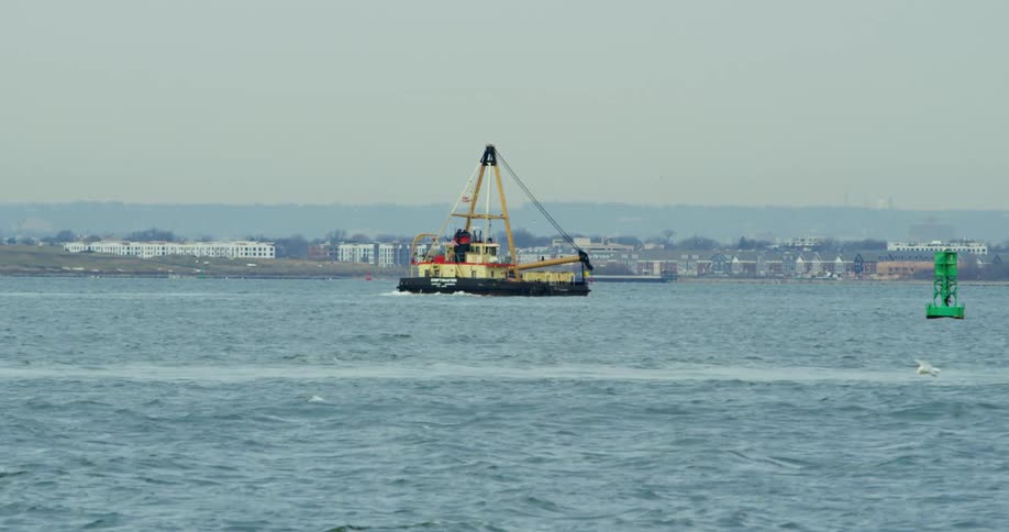 A ship sails past in the water