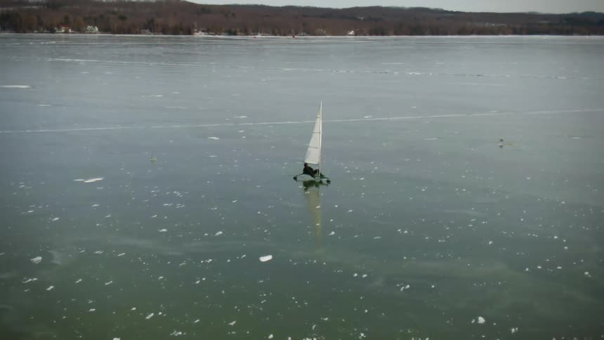 A person ice boating on a lake