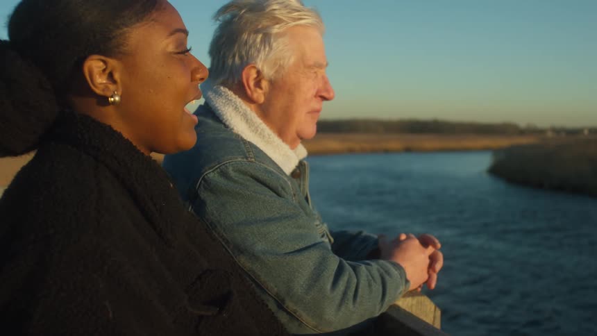 Two people standing outdoors talking