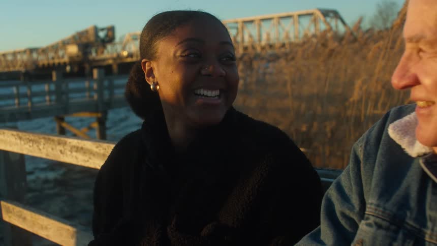 Two people standing outdoors talking