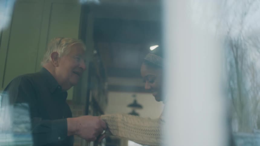 Two people are dancing inside
