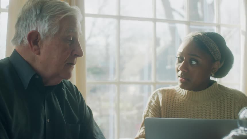 Two people talking in a room