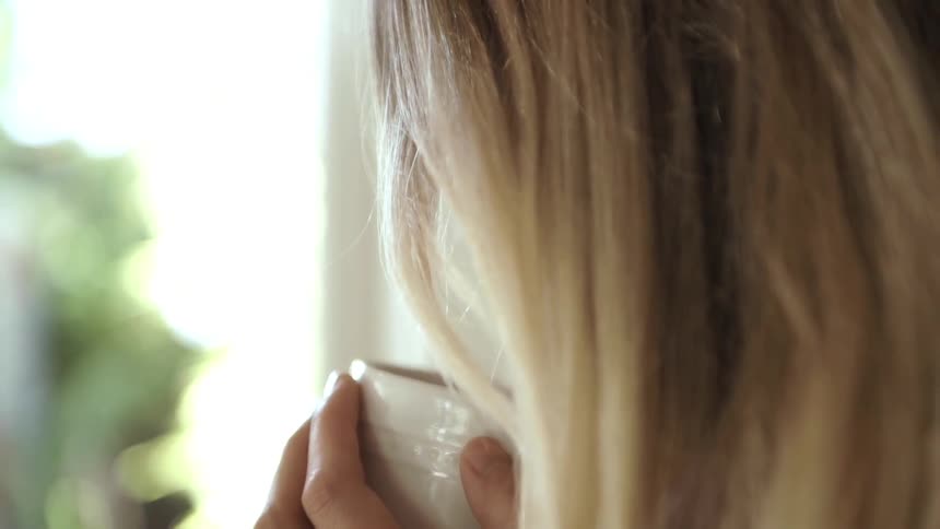 Woman drinking from a coffee mug