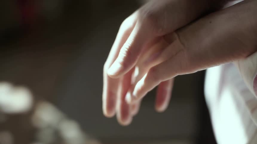 Hands slowly touching