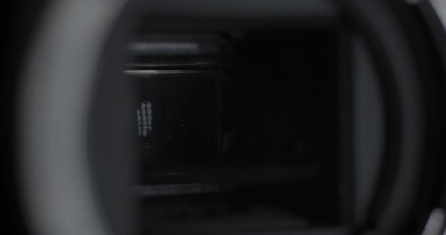 A camera shutter opening and closing
