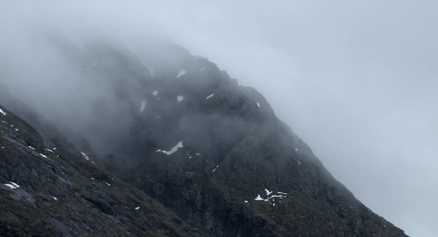 Fog flowing around a mountain