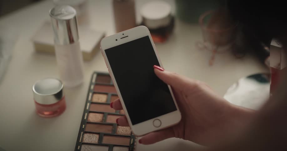 A woman using a smartphone in a room
