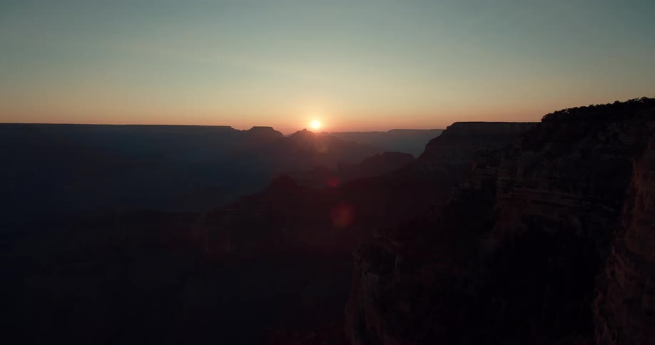 The sun setting over a mountain range